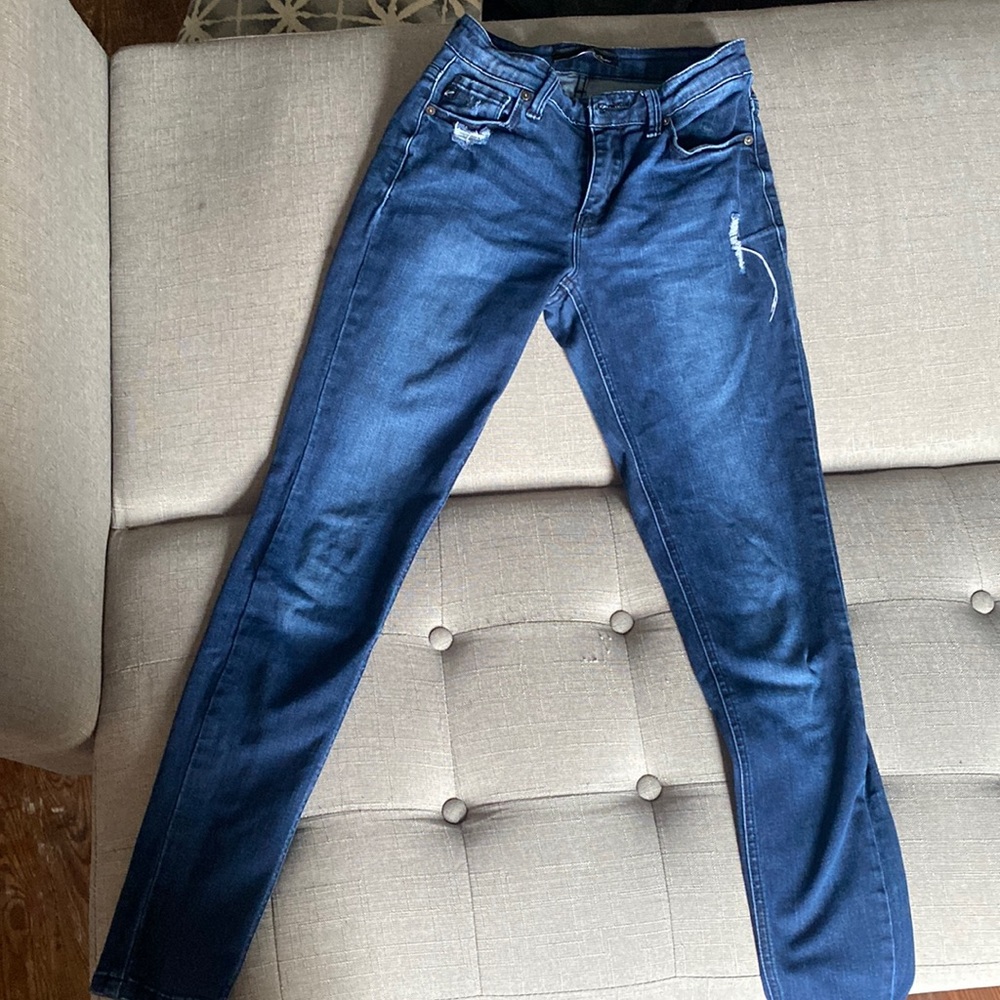 Dark blue lightly distressed skinny jeans